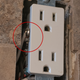 The prongs on the ConnectLight outlet cover make contact with these metal screws found on the sides of almost any outlet.